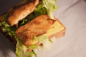 Delicious Grilled Meat Sandwich with Lettuce and Cheese
