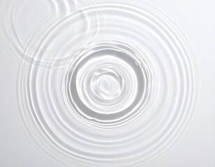 Abstract ripple in a puddle of water on white surface