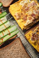 Delicious Breakfast Sandwiches with Egg, Bacon, and Cucumber