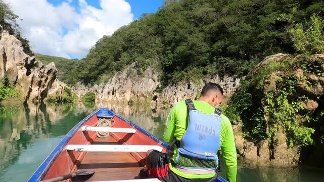 Boating at the breathtaking Tamul waterfall, Huasteca Potosina, San Luis Potosi, Mexico