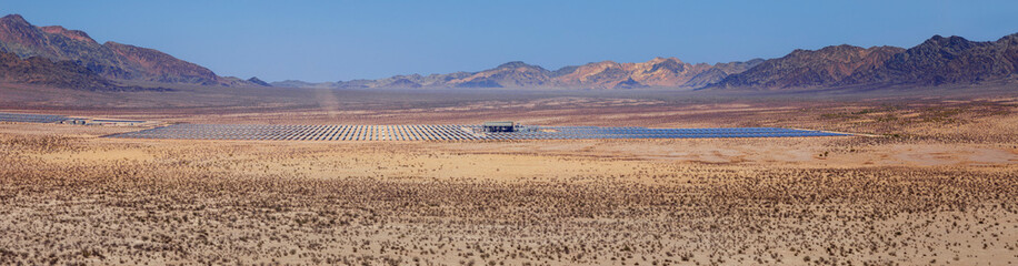 Aerial Panoramic view of Ford Dry Lake with solar thermal plant in distance