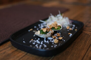 Baked stuffed fresh mussels in shell. to take food out of a shell with a fork. Baked stuffed clams