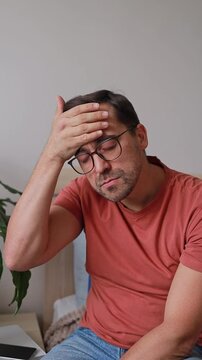 Vertical Video Man Touching Forehead and Head Due to Headache, Feeling Unwell, Blood Pressure