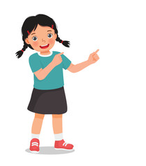 Little girl pointing finger to right side at copy space