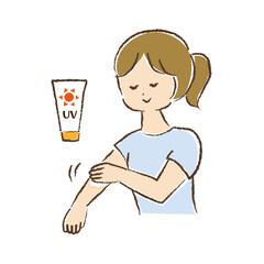 腕に日焼け止めクリームを塗っている女性