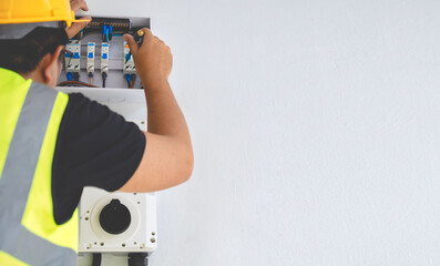 Electrical Maintenance: Worker Installing or Repairing EV Charging Unit