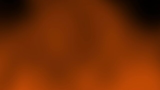 A smooth, abstract orange and black blurred gradient background with no defined shapes or objects, Abstract texture Gradient motion Background animation.