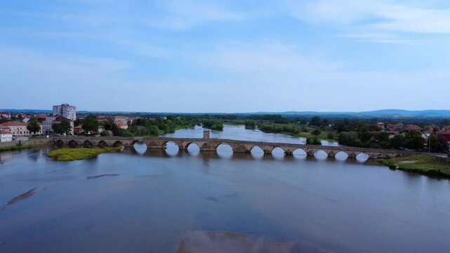 Aerial drone view of the Old Bridge in Svilengrad, Bulgaria. Built between 1512&ndash;1529, this historic Ottoman stone bridge spans the Maritsa River with graceful arches.
