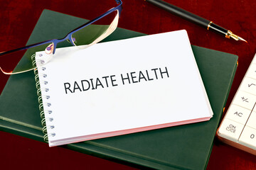 Medicine and Bladder Cancer concept. Copy space. RADIATE HEALTH written on a blank page of a...