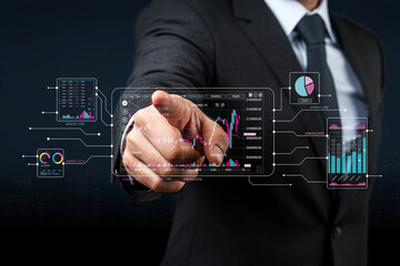 Businessman in Suit Interacting with Digital Finance Graphs and Data Visualizations on Transparent Screen for Investment and Analytics Concept