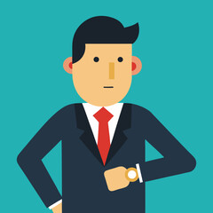 Businessman checking time on wristwatch