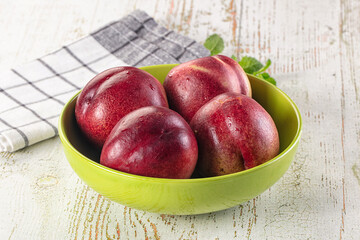 Ripe sweet juicy nectarines heap