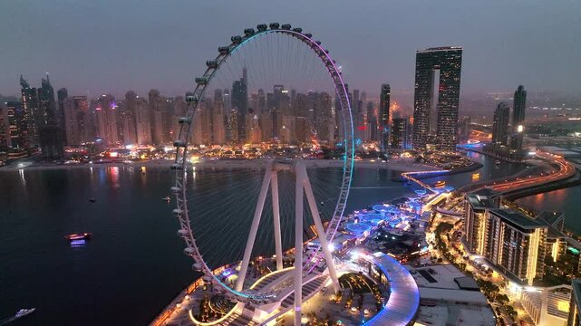 Aerial view of Bluewaters Island in Dubai Marina illuminated at night