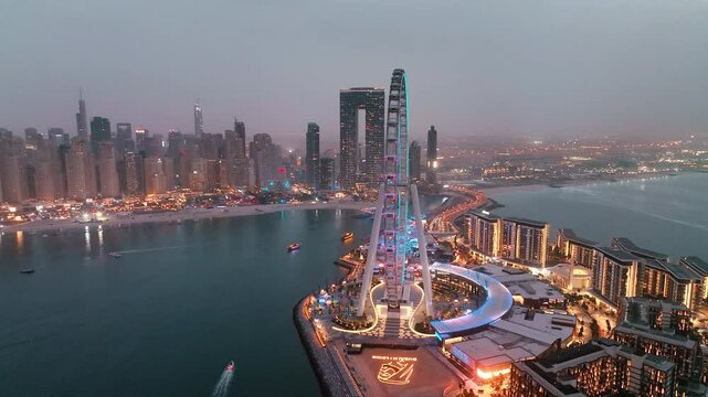 Aerial view of Bluewaters Island in Dubai Marina illuminated at night