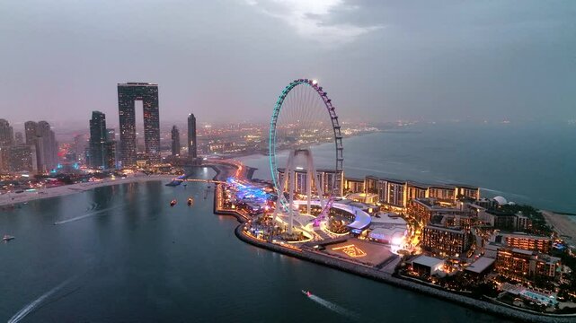 Aerial view of Bluewaters Island in Dubai Marina illuminated at night