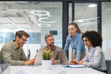 Business team discussing together business plans in office.
