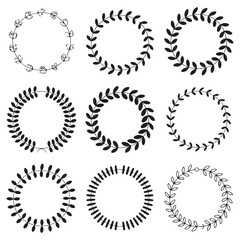 Collection of Black Laurel Wreath Icons - Decorative Symbol on White Background