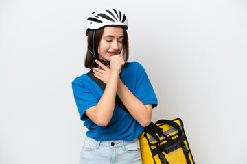 Young Ukrainian woman with thermal backpack isolated on white background is suffering with cough and feeling bad