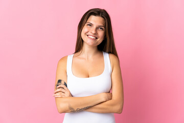Young slovak woman isolated on pink background keeping the arms crossed in frontal position