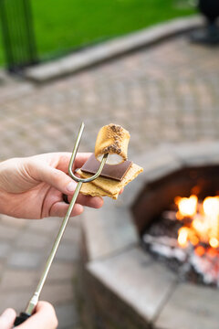 Creating the Perfect S'more by a Firepit
