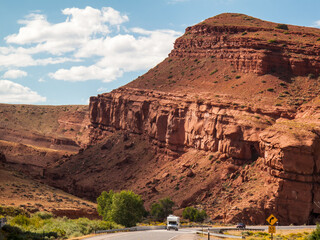 RV driving past red rocks at scenic turnout near Crowheart, Wyoming