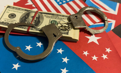 flags of different countries and handcuffs