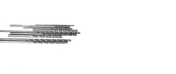 High speed steel spiral drill bits designed for cutting metal in manufacturing environments, shown from above on a clean white background, ideal for industry, tool, and hardware photo needs