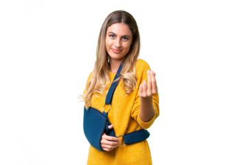 Young Uruguayan woman with broken arm and wearing a sling over isolated background making money gesture