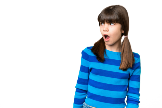 Little caucasian girl over isolated background doing surprise gesture while looking to the side