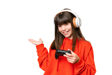 Little caucasian girl playing with a video game controller over isolated background extending hands to the side for inviting to come