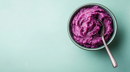 A&nbsp;sphere&nbsp;tiny&nbsp;ceramic&nbsp;dish&nbsp;laden&nbsp;with&nbsp;mashed&nbsp;purple sweet potato and&nbsp;metal spoon over&nbsp;pale green setting lovely delish food, Generative AI.