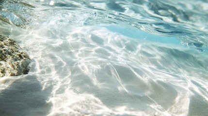 Obraz premium Crystal-clear water washing over white sand in the Maldives