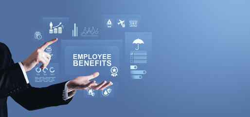Businessman interacting with digital icons representing employee benefits on futuristic blue interface screen in professional modern concept display.