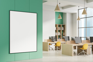 Blank poster mockup in modern open office interior with green accent wall and bright workspace design for professional presentation template. 3D Rendering