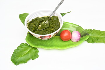 Indian Spinach and Potato Curry. Indian vegetable curry with spinach and potato. A dry dish made from fried potatoes and spinach in Indian style. 
