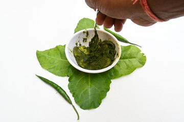 Indian Spinach and Potato Curry. Indian vegetable curry with spinach and potato. A dry dish made from fried potatoes and spinach in Indian style. 
