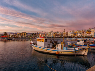 Fototapeta premium Sunset over the harbor of Sitia in Crete