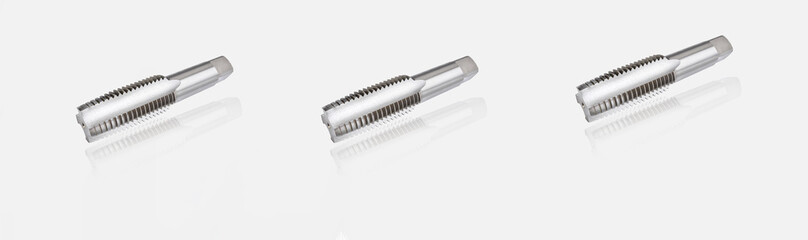 Thread tap with four straight flute for right-hand screws made of high speed steel, isolated on white background, industrial cutting tool for precise metal machining and engineering applications.