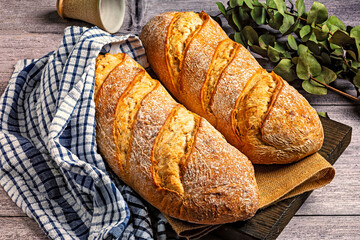 Rustic loaves of bread with checked cloth