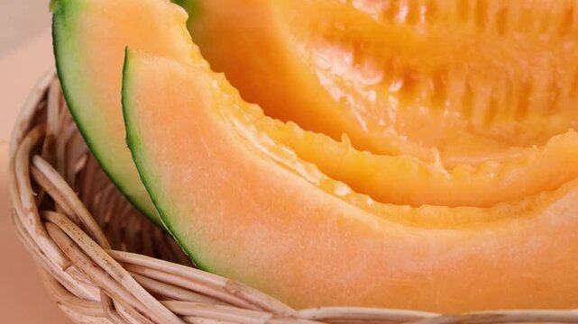 Sliced ​​orange melon in a basket