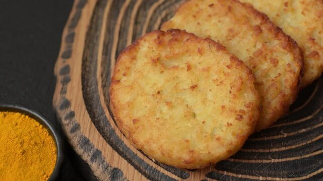 Potato hash browns, a meal with onions, cabbage in the form of fritters. Vegetable healthy breakfast