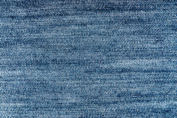 Texture of blue denim fabric. Textile. Jeans. Fashion