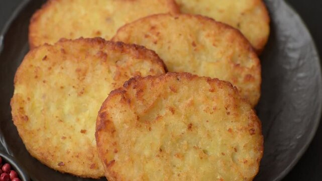 Potato hash browns, a meal with onions, cabbage in the form of fritters. Vegetable healthy breakfast