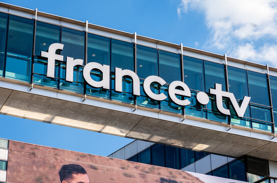 Paris, France - April 28, 2025: Close-up view of the logo of France T&eacute;l&eacute;visions, the French national public television broadcaster, on the facade of its headquarters.
