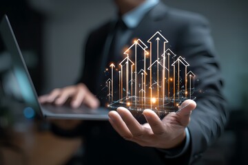 Businessman holding laptop with digital arrows, symbolizing growth and progress