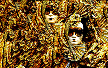 a background of carnival masks with golden costumes