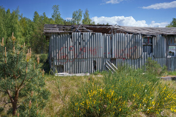 Old and very dangerous asbestos roof. Asbestos dust in the environment. Asbestos removal