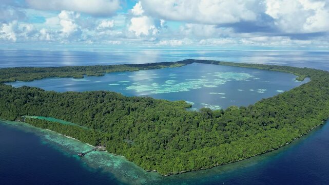 Kakaban, Indonesia: Cinematic aerial drone footage with a tilt down motion of the Kakaban island in the Derawan archipelago in Indonesia Borneo. 