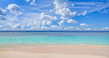 Peaceful empty sunny beach closeup view soft golden sand gentle sea waves. Sunshine blue sky clouds. Tranquil seascape horizon. Relaxing tropical shore escape. Inspire nature beauty summer vacation
