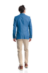 Fototapeta premium casual young guy in blue jacket stepping forward and looking up